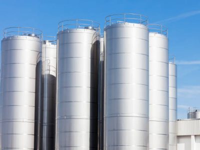 Stainless Steel storage tanks await deliveries of raw milk at the  dairy factory.